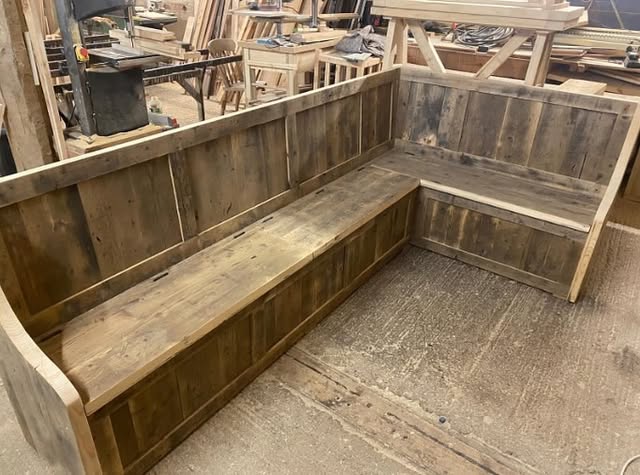 Wooden corner bench with panelled back and armrest